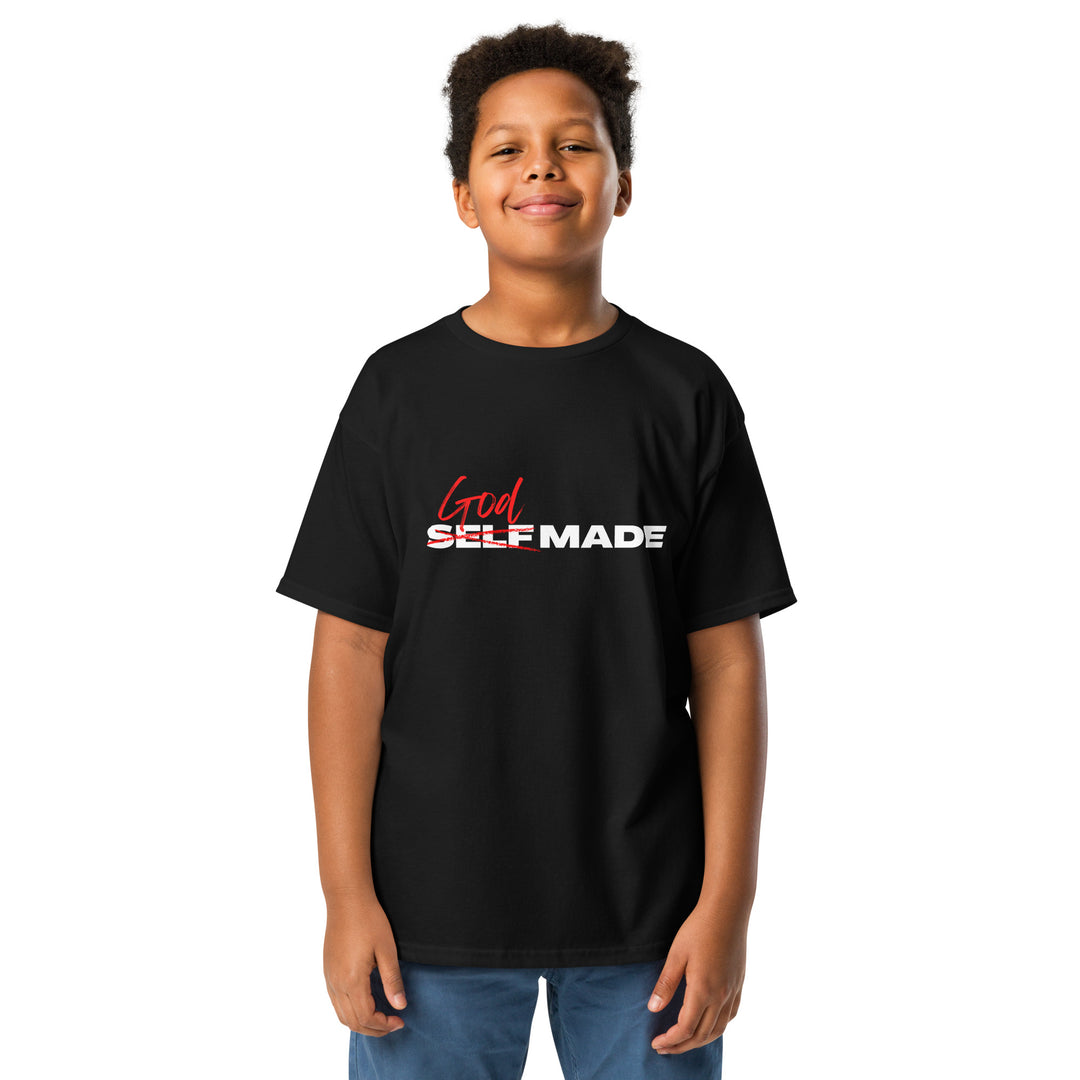 Child wearing a black t-shirt with 'God Self Made' text on a white background