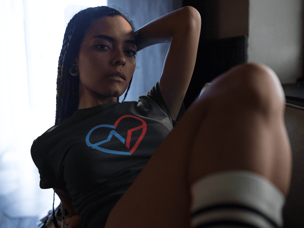 Black woamn layign back relaxing in Love Clan Signature Tee