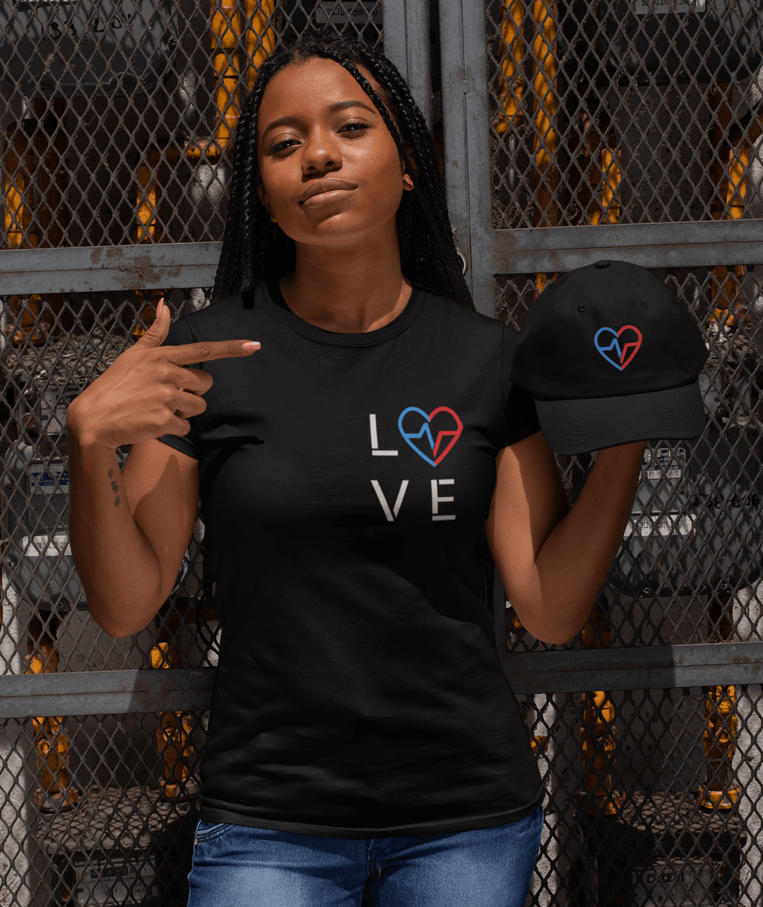 Pretty black woman wearing Love Season T by Norian Love and rocking a Love CLan hat 