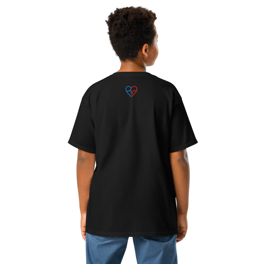 Person wearing a black t-shirt with God Made Shirt on  a heart design on the back, standing against a white background 