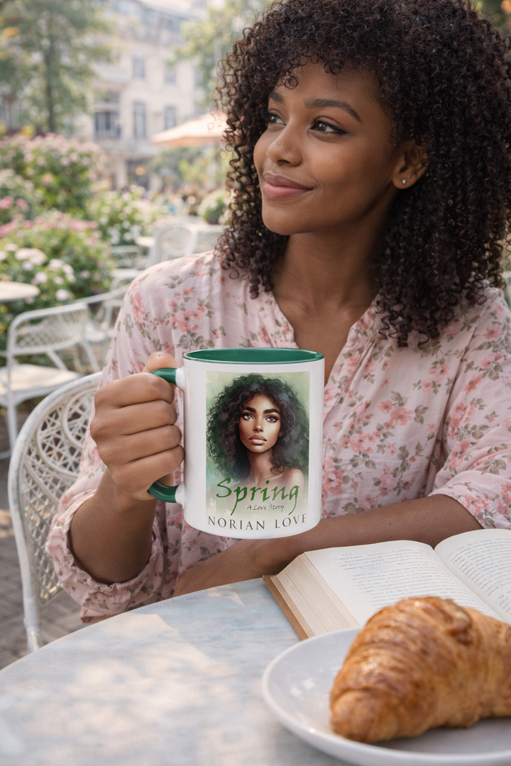 Woman holding a mug with a book cover on it, sitting outdoors with a plate of food.