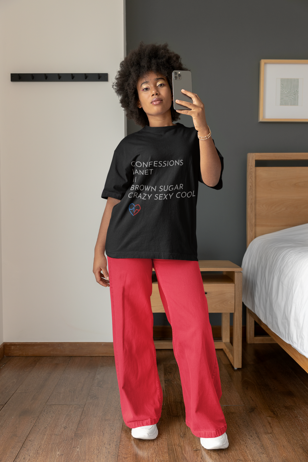 woman at home, taking a selfie wihile wearing the R&B Essentials Tee – Love Clan Classics by Norian Love