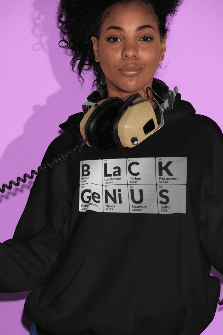 Black woman wearing Black Genius hoodie with periodic table design representing HBCU pride and STEM empowerment