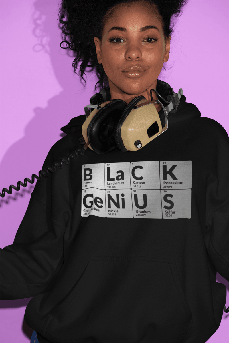 Black woman wearing Black Genius hoodie with periodic table design representing HBCU pride and STEM empowerment