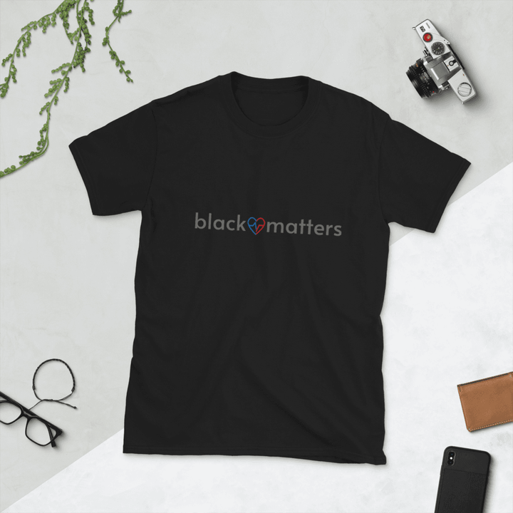 Black Love Matters shirt on a black flatlay background