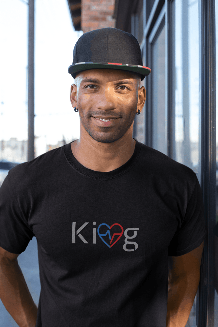 Black man wearing Love Is King modern men’s graphic motivational tee outside