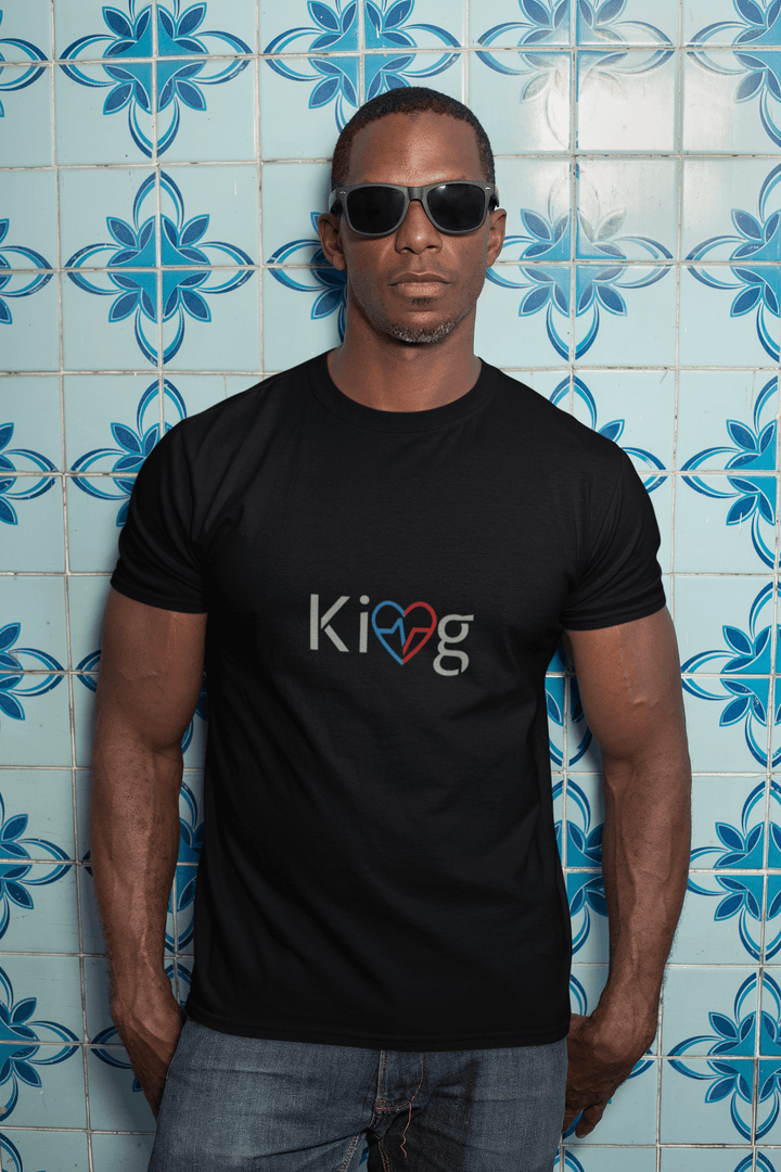 Man modeling Love Is King graphic tee in outdoor setting