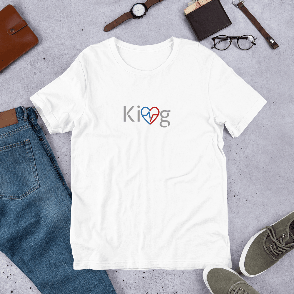 White Love Is King men’s motivational t-shirt flatlay on concrete 