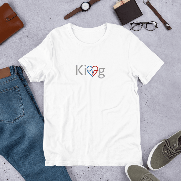 White Love Is King men’s motivational t-shirt flatlay on concrete 