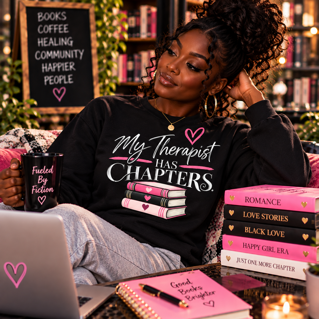 Dark-skinned woman wearing My Therapist Has Chapters crewneck sweatshirt in a reading lounge
