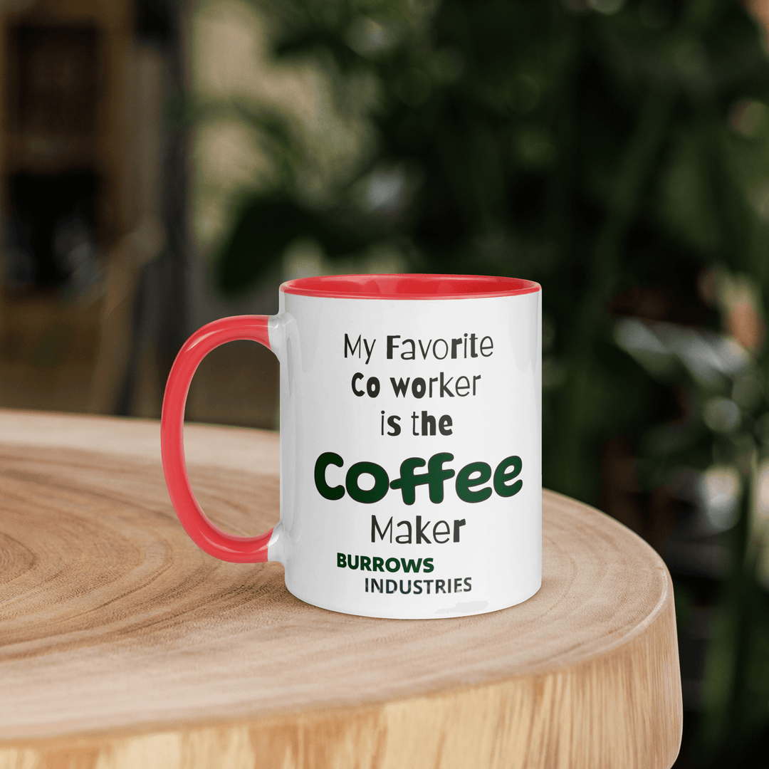 White ceramic mug with red interior and handle displaying the Burrows Industries slogan stating the coffee maker is the favorite co-worker.