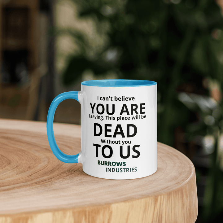 White ceramic mug with light blue handle and interior displaying the Burrows Industries farewell message.